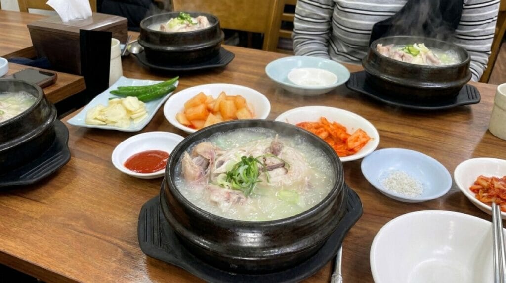 Dongdaemun food guide - Cheonil Samgyetang chicken soup with traditional side dishes