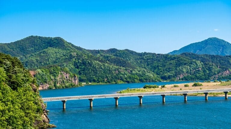 Cliffside river bend along the Nakdonggang Bicycle Path (Lower) near Hwangsan Berang-gil
