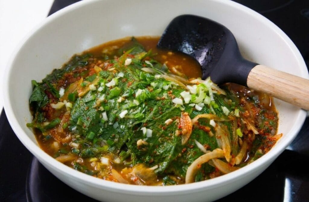 Finished steamed perilla leaves recipe (kkaennip-jjim) mixed with sauce in the pan