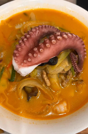 Spicy seafood champon soup topped with a whole octopus tentacle at Miseong Banjeom